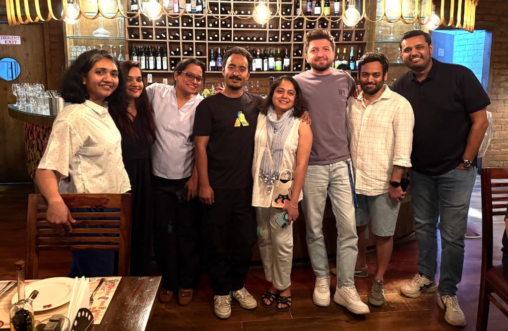 Team photo with colleagues at an evening gathering